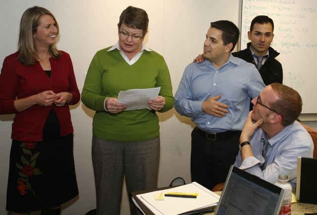 AFER-DWalker-Pic4Med Perry Plaintiffs (from left to right) Sany Stier, Kris Perry, Jeff Zarrillo and Paul Katami stand, as Chad Griffin, seated, looks on. (Image from Diana Walker via AFER.)